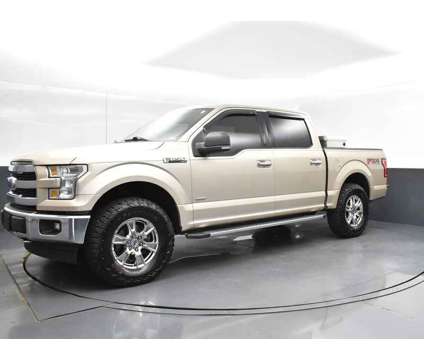 2017 Ford F-150 XLT is a Gold, White 2017 Ford F-150 XLT Truck in Jackson MS