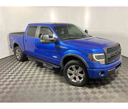 2011 Ford F-150 FX4 is a Blue 2011 Ford F-150 FX4 Truck in Athens OH