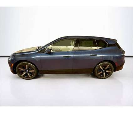 2025 BMW iX xDrive50 is a Blue 2025 BMW 325 Model iX SUV in Peabody MA