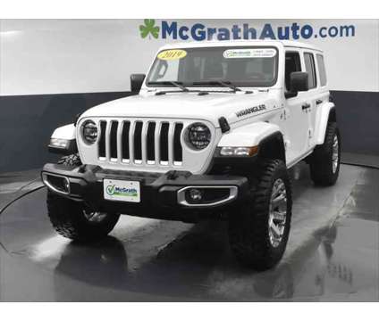 2019 Jeep Wrangler Unlimited Sahara is a White 2019 Jeep Wrangler Unlimited Sahara SUV in Dubuque IA