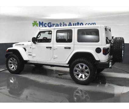 2019 Jeep Wrangler Unlimited Sahara is a White 2019 Jeep Wrangler Unlimited Sahara SUV in Dubuque IA