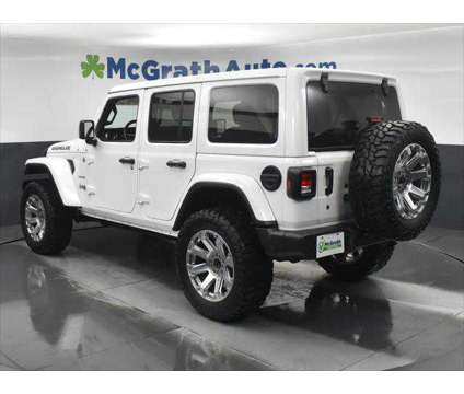 2019 Jeep Wrangler Unlimited Sahara is a White 2019 Jeep Wrangler Unlimited Sahara SUV in Dubuque IA