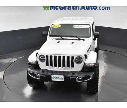 2019 Jeep Wrangler Unlimited Sahara is a White 2019 Jeep Wrangler Unlimited Sahara SUV in Dubuque IA