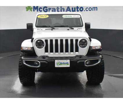 2019 Jeep Wrangler Unlimited Sahara is a White 2019 Jeep Wrangler Unlimited Sahara SUV in Dubuque IA