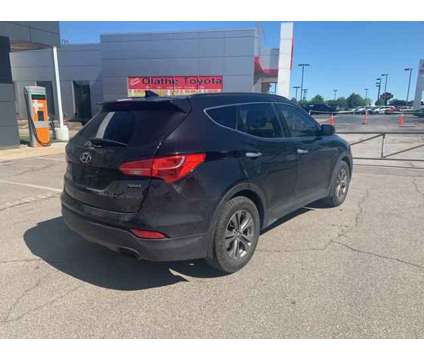 2015 Hyundai Santa Fe Sport 2.4L is a Black 2015 Hyundai Santa Fe Sport 2.4L Car for Sale in Olathe KS