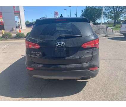 2015 Hyundai Santa Fe Sport 2.4L is a Black 2015 Hyundai Santa Fe Sport 2.4L Car for Sale in Olathe KS