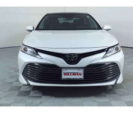 2019 Toyota Camry XLE is a White 2019 Toyota Camry XLE Sedan in Houston TX