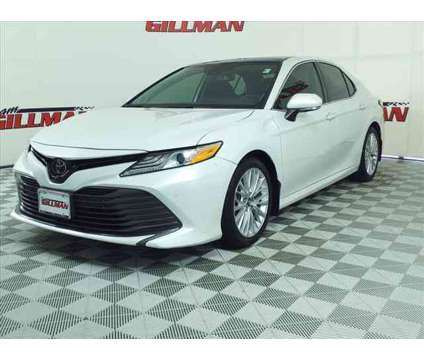 2019 Toyota Camry XLE is a White 2019 Toyota Camry XLE Sedan in Houston TX