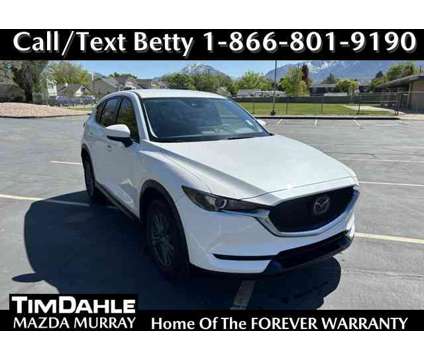 2021 Mazda CX-5 Sport AWD is a White 2021 Mazda CX-5 Sport SUV in Salt Lake City UT