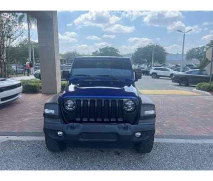 2020 Jeep Wrangler Unlimited Willys is a Blue 2020 Jeep Wrangler Unlimited Car for Sale in Orlando FL