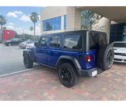 2020 Jeep Wrangler Unlimited Willys is a Blue 2020 Jeep Wrangler Unlimited Car for Sale in Orlando FL