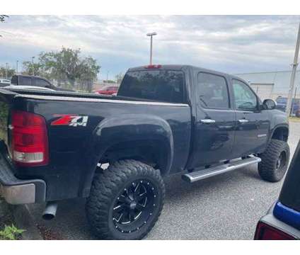 2011 Gmc Sierra 1500 SLE is a Black 2011 GMC Sierra 1500 SLE Car for Sale in Orlando FL