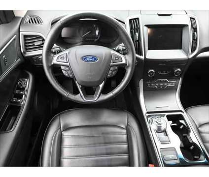 2019 Ford Edge SEL is a White 2019 Ford Edge SEL SUV in Dubuque IA