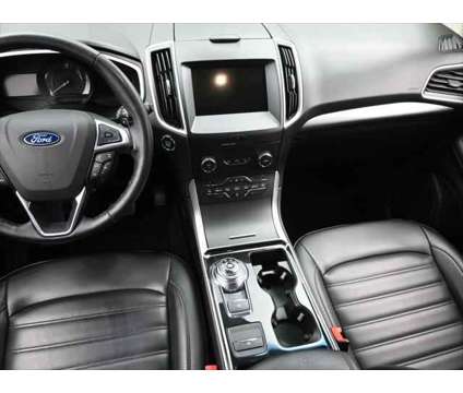2019 Ford Edge SEL is a White 2019 Ford Edge SEL SUV in Dubuque IA
