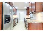 Kitchen in Cherry-wood cabinets and granite counters!