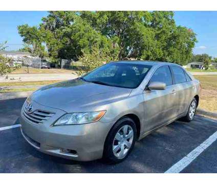 2009 Toyota Camry for sale is a Gold 2009 Toyota Camry Car for Sale in Saint Cloud FL