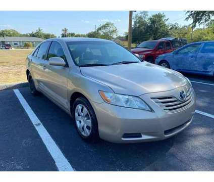 2009 Toyota Camry for sale is a Gold 2009 Toyota Camry Car for Sale in Saint Cloud FL