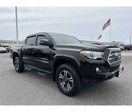 2016 Toyota Tacoma TRD Sport is a Black 2016 Toyota Tacoma TRD Sport Car for Sale in Southaven MS