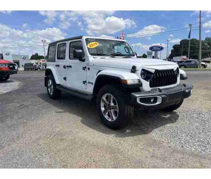 2019 Jeep Wrangler Unlimited Sahara is a White 2019 Jeep Wrangler Unlimited Sahara Car for Sale in Covington TN