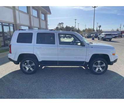 2016 Jeep Patriot HIGH ALTITUDE is a White 2016 Jeep Patriot High Altitude Car for Sale in Traverse City MI