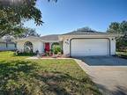 delightfully, charming 4/2 Block and stucco home with a two car garage