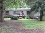 5+/- acres with a four bedroom three bath 1993 manufactured home