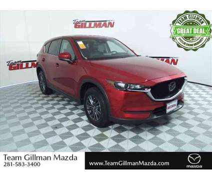 2021 Mazda CX-5 Touring is a Red 2021 Mazda CX-5 Touring SUV in Houston TX