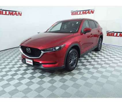 2021 Mazda CX-5 Touring is a Red 2021 Mazda CX-5 Touring SUV in Houston TX