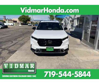 2024 Honda CR-V Hybrid Sport Touring is a Silver, White 2024 Honda CR-V Hybrid in Pueblo CO