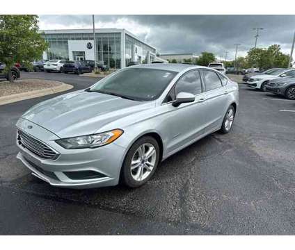 2018 Ford Fusion Hybrid SE is a Silver 2018 Ford Fusion Hybrid SE Hybrid in Lees Summit MO