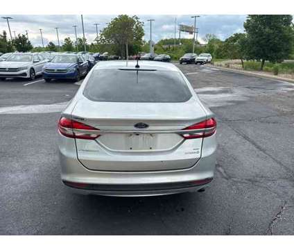 2018 Ford Fusion Hybrid SE is a Silver 2018 Ford Fusion Hybrid SE Hybrid in Lees Summit MO