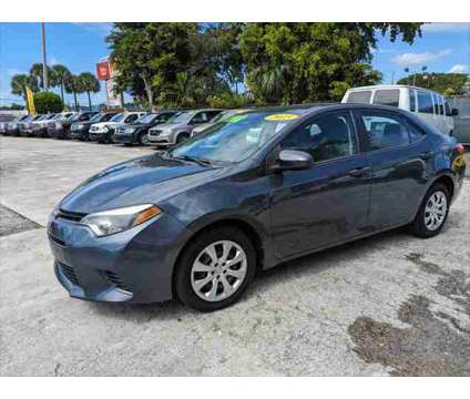 2015 Toyota Corolla LE Plus is a Blue 2015 Toyota Corolla LE Car for Sale in Fort Lauderdale FL