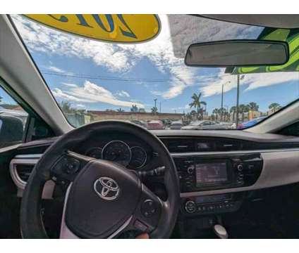 2015 Toyota Corolla LE Plus is a Blue 2015 Toyota Corolla LE Car for Sale in Fort Lauderdale FL