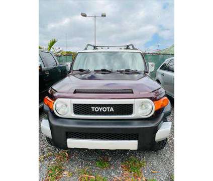 2007 Toyota FJ Cruiser 2WD 4dr Auto (Natl) is a Red 2007 Toyota FJ Cruiser 2WD 4dr Auto (Natl) Car for Sale in Fort Lauderdale FL