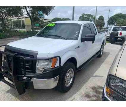 2014 Ford F-150 XLT is a White 2014 Ford F-150 XLT Truck in Fort Lauderdale FL