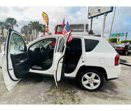 2014 Jeep Compass Latitude is a White 2014 Jeep Compass Latitude SUV in Fort Lauderdale FL