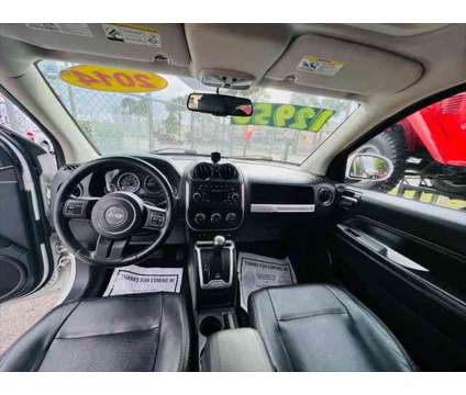 2014 Jeep Compass Latitude is a White 2014 Jeep Compass Latitude SUV in Fort Lauderdale FL
