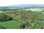 Bonners Ferry, 10 wooded, surveyed acres in private setting