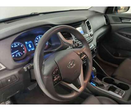 2016 Hyundai Tucson SE is a Black 2016 Hyundai Tucson SE SUV in Columbus OH