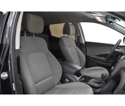 2014 Hyundai Santa Fe Sport 2.4L is a Black 2014 Hyundai Santa Fe Sport 2.4L SUV in Lawrence KS