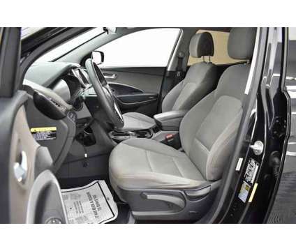 2014 Hyundai Santa Fe Sport 2.4L is a Black 2014 Hyundai Santa Fe Sport 2.4L SUV in Lawrence KS