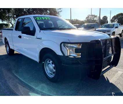 2015 Ford F-150 XLT is a White 2015 Ford F-150 XLT Car for Sale in Fort Lauderdale FL