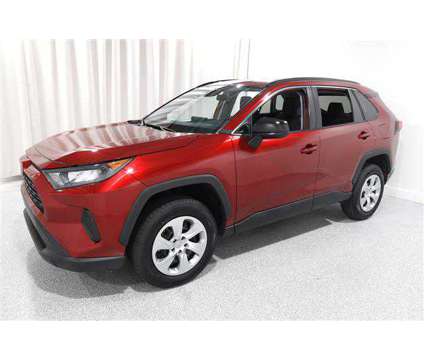 2021 Toyota RAV4 LE is a Red 2021 Toyota RAV4 LE SUV in Mentor OH