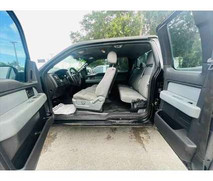 2013 Ford F-150 XLT is a Black 2013 Ford F-150 XLT Truck in Fort Lauderdale FL