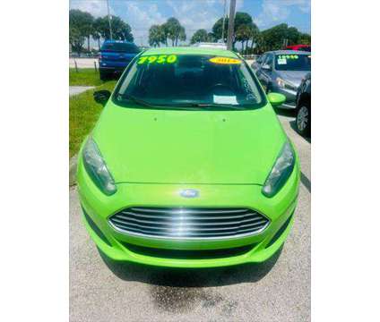 2014 Ford Fiesta SE is a Green 2014 Ford Fiesta SE Sedan in Fort Lauderdale FL