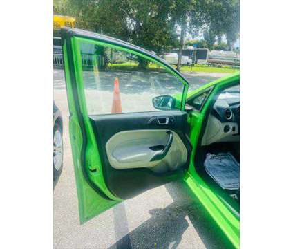 2014 Ford Fiesta SE is a Green 2014 Ford Fiesta SE Sedan in Fort Lauderdale FL