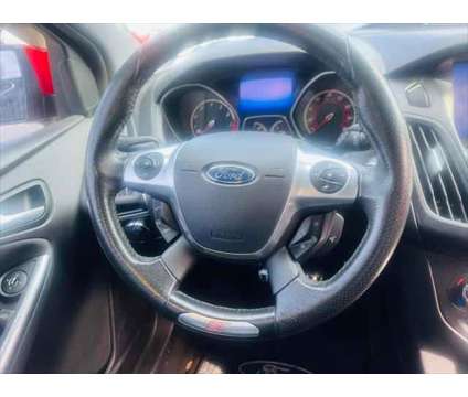 2013 Ford Focus ST 4dr Hatchback is a Red 2013 Ford Focus ST Car for Sale in Fort Lauderdale FL