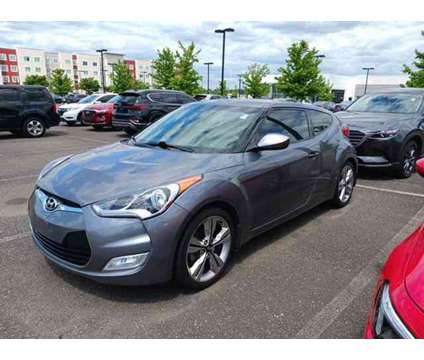 2016 Hyundai Veloster Base (A6) is a Grey 2016 Hyundai Veloster Base Car for Sale in Capitol Heights MD