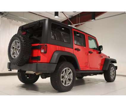 2017 Jeep Wrangler Unlimited Rubicon is a Red 2017 Jeep Wrangler Unlimited Rubicon Car for Sale in Pueblo CO
