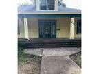 Foreclosure Property: E 3rd St S